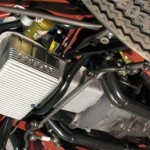 The underside of a motorcycle with an air conditioning unit.