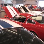 A group of classic cars on display at a show.