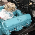 A blue engine is sitting in a truck.