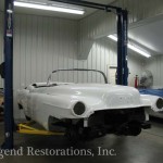 Closeup shot of white color car under repair