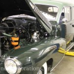 Vintage green color car for repair on the display