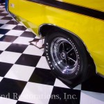 A yellow and black checkered floor in a showroom.