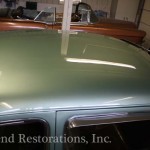 Close view of green color car for repair on the display