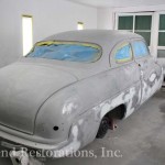 Close view of gray color car for repair on the display