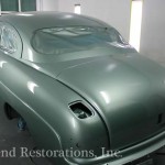 Close view of green color car for repair on the display