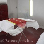 A room with a table covered in red and white cloths.