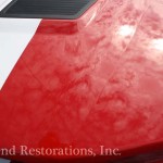 The hood of a red and white sports car.